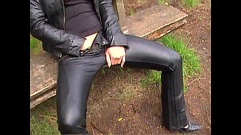 Blonde in leather pants and leather jacket masturbating outdoors